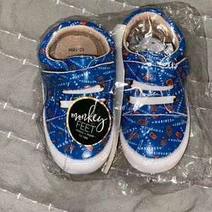 NIP Monkey Feet hard sole support our troops sneakers. 12-18 months